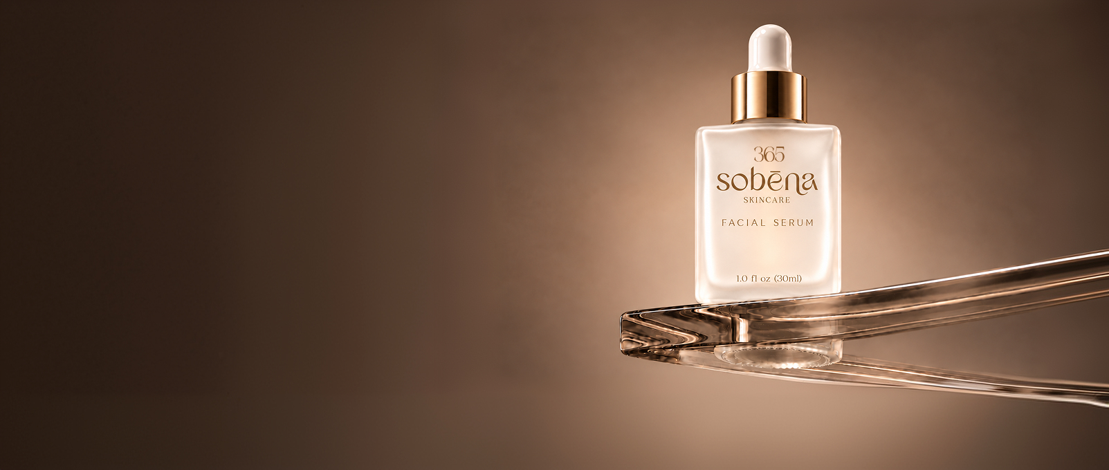Serum 365 by Sobēna facial serum bottle illuminated in champagne light